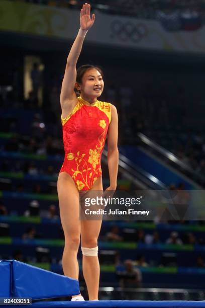 He Wenna of China aknowledges the crowd after winning gold in the trampoline women?s final gymnastics event at the National Indoor Stadium on Day 10...