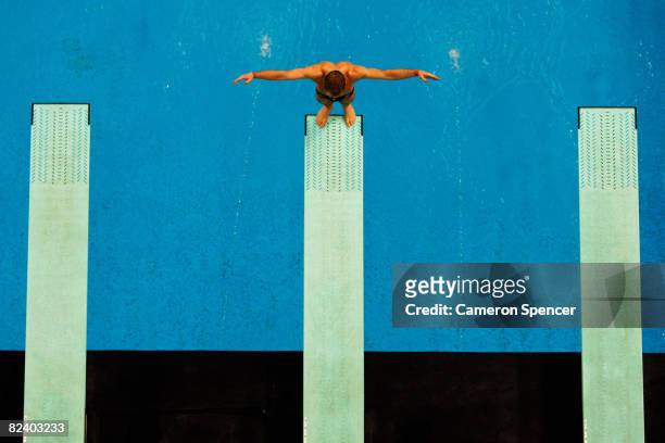 Competitor prepares to dive competes in the Men's 3m Springboard Preliminary held at the National Aquatics Center on Day 10 of the Beijing 2008...