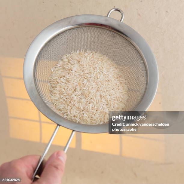 Using A Sieve For Rice 197 Rice Sieve Stock Photos, High-Res Pictures, and Images - Getty Images