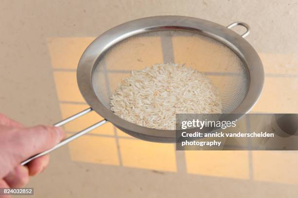 Using A Sieve For Rice 197 Rice Sieve Stock Photos, High-Res Pictures, and Images - Getty Images