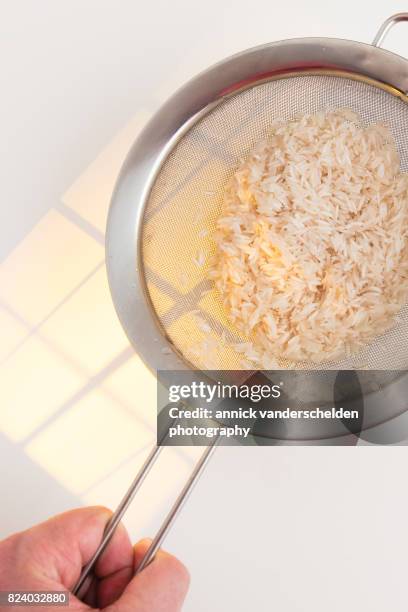 Using A Sieve For Rice Rice Sieve Photos and Premium High Res Pictures - Getty Images