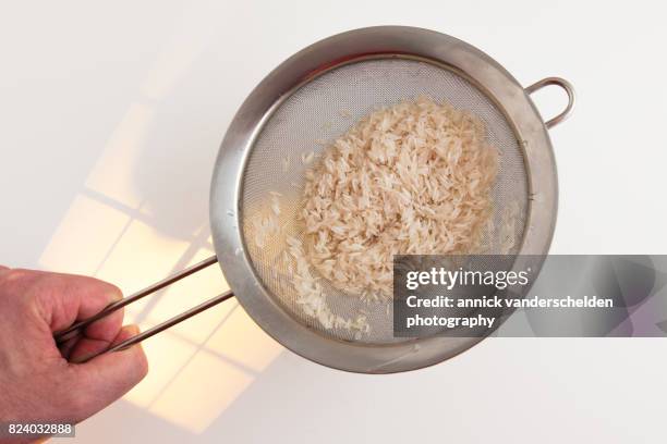 Using A Sieve For Rice 197 Rice Sieve Stock Photos, High-Res Pictures, and Images - Getty Images
