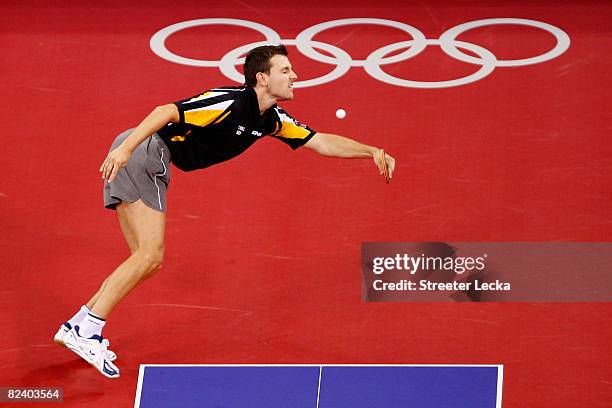 Timo Boll of Germany plays a shot during the Men's Team Contest against China at the Peking University Gymnasium on Day 10 of the Beijing 2008...