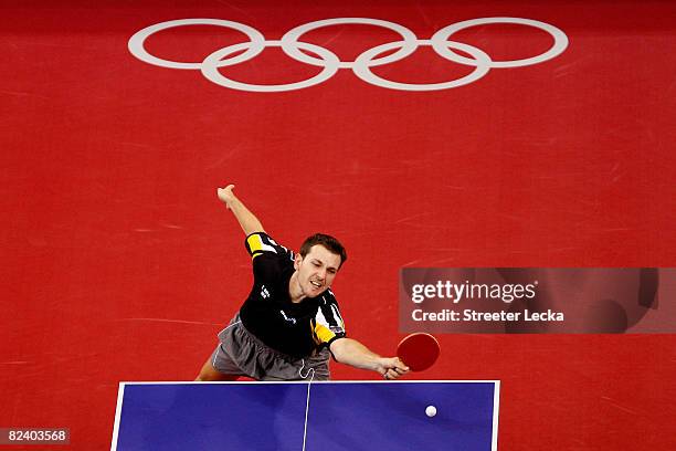 Timo Boll of Germany plays a shot during the Men's Team Contest against China at the Peking University Gymnasium on Day 10 of the Beijing 2008...