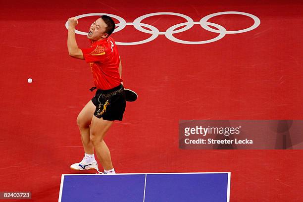 Hao Wang of China celebrates a point during the Men's Team Contest against Germany at the Peking University Gymnasium on Day 10 of the Beijing 2008...