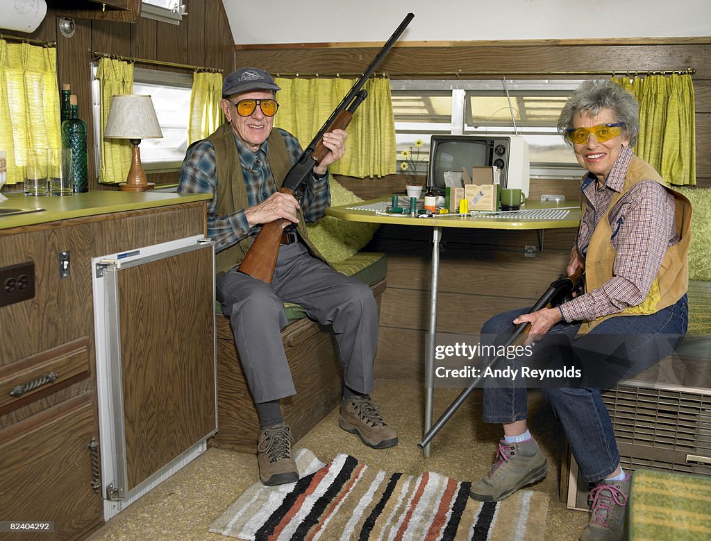 Man and woman with guns