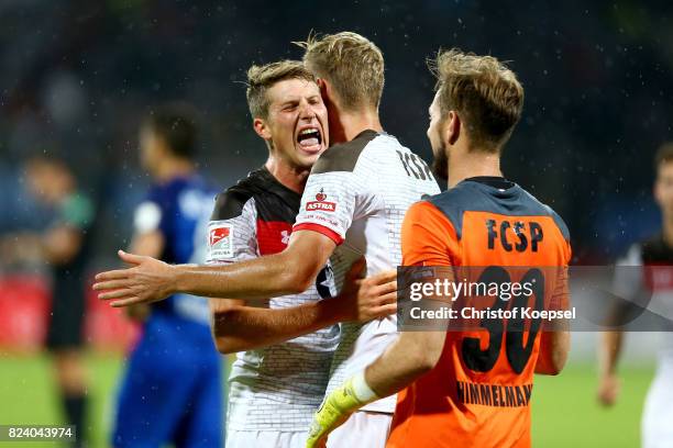 Daniel Buballa, Jan-Philipp Kalla and Robin Himmelmann of St. Pauli celebrate after winning the Second Bundesliga match between VfL Bochum 1848 and...