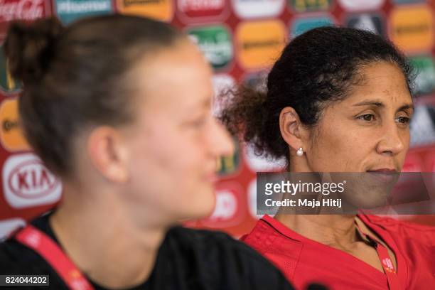 Head Coach Steffi Jones of Germany and Almuth Schult listen to a questions during a press conference prior the Quarter Final on July 28, 2017 in...