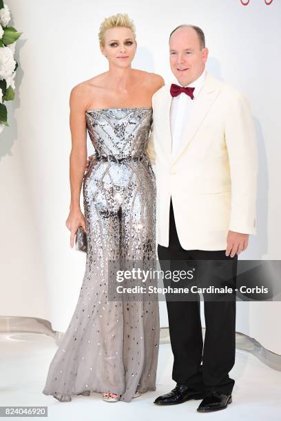 Princess Charlene of Monaco and Prince Albert II of Monaco attend the 69th Monaco Red Cross Ball Gala at Sporting Monte-Carlo on July 28, 2017 in...