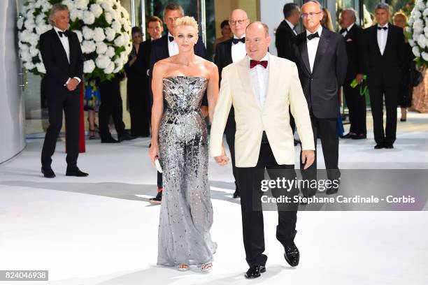 Princess Charlene of Monaco and Prince Albert II of Monaco attend the 69th Monaco Red Cross Ball Gala at Sporting Monte-Carlo on July 28, 2017 in...