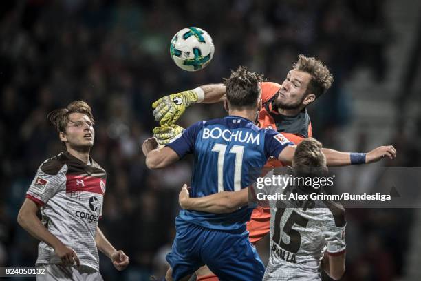 Goalkeeper Robin Himmelmann of St. Pauli clears the ball ahead of Dimitrios Diamantakos of Bochum during the Second Bundesliga match between VfL...