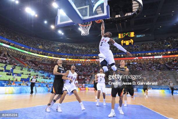 Dwyane Wade of the U.S. Men's Senior National Team dunks against Germany during the men's group B basketball preliminaries at the 2008 Beijing...