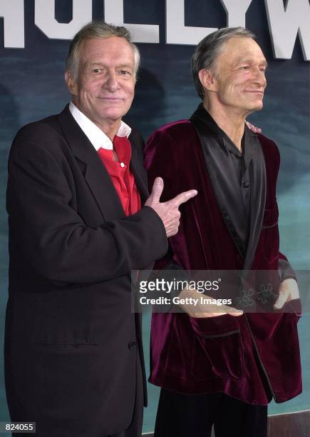 Playboy Magazine founder Hugh M. Hefner, left, points to his likeness in wax outside the Hollywood Wax Musuem February 20, 2001 in Hollywood, CA. The...