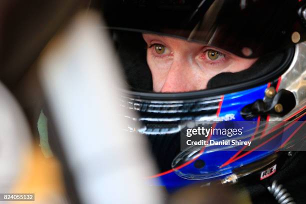 Ben Kennedy, driver of the RTP/Rheem Chevrolet, sits in his car during practice for the NASCAR XFINITY Series US Cellular 250 Presented by American...