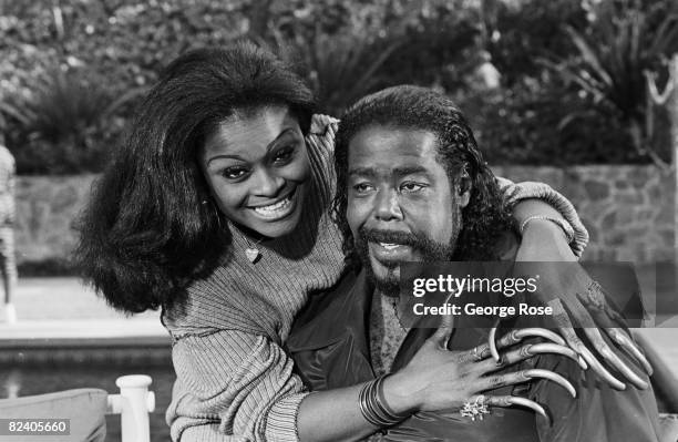 American soul singer and multiple Grammy Award winner, Barry White, poses with his second wife, Glodean James, during a 1988 Los Angeles, California,...