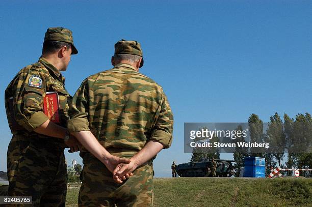 Russian peacekeeper troops stand guard at the Georgian-South Ossetian bordercrossing leading towards the breakaway region's capital of Tskhinvali...
