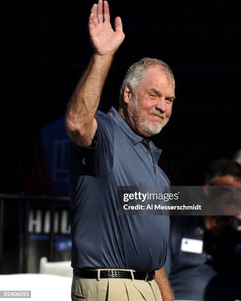 Merlin Olsen of the Los Angeles Rams greets fans before the Class of 2008 Pro Football Hall of Fame Enshrinement Ceremony at Fawcett Stadium on...