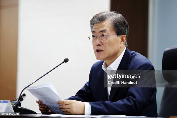In this handout photo released by the South Korean Presidential Blue House, South Korean President Moon Jae-in speaks as he presides over a meeting...