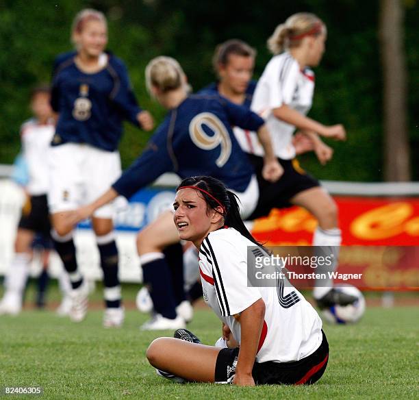 Annika Ernst of Germany sits injured on the pitch during the Women U15 international friendly match between Germany and Scotland at the Mons Tabor...