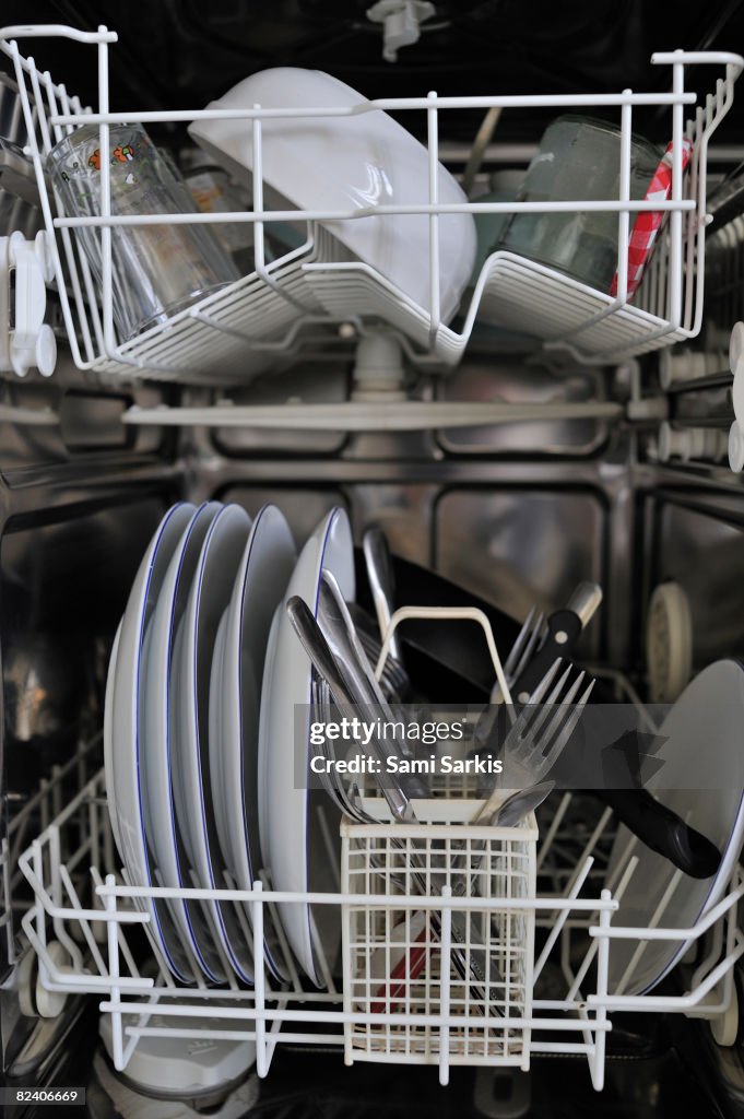 Clean dishes inside dishwasher machine