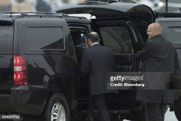 Reince Priebus, outgoing White House chief of staff, left, climbs into a vehicle after stepping out of Air Force One in Joint Base Andrews, Maryland,...