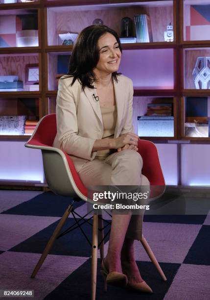 Sheryl Sandberg, chief operating officer of Facebook Inc., smiles during a Bloomberg Studio 1.0 television interview at Facebook headquarters in...