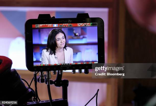 Sheryl Sandberg, chief operating officer of Facebook Inc., is seen on a monitor during a Bloomberg Studio 1.0 television interview at Facebook...