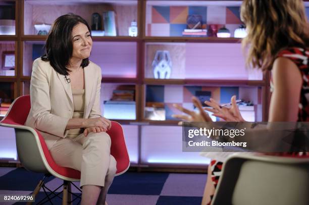 Sheryl Sandberg, chief operating officer of Facebook Inc., listens during a Bloomberg Studio 1.0 television interview at Facebook headquarters in...