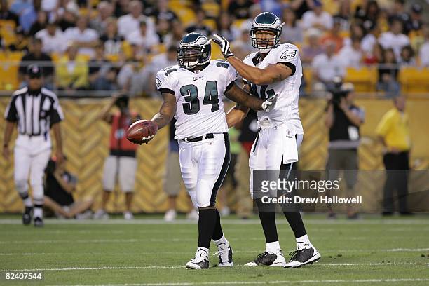 Running back Jason Davis and tight end L.J. Smith of the Philadelphia Eagles celebrate during the game against the Pittsburgh Steelers on August 8,...