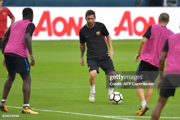 Barcelona players Lionel Messi takes part in a training session at Hard Rock Stadium in Miami, Florida, on July 28 one day before their International...