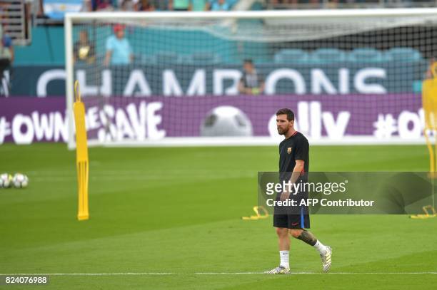 Barcelona player Lionel Messi takes part in a training session at Hard Rock Stadium in Miami, Florida, on July 28 one day before their International...