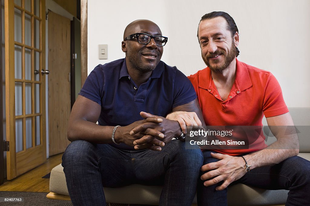 Portrait of male couple in home