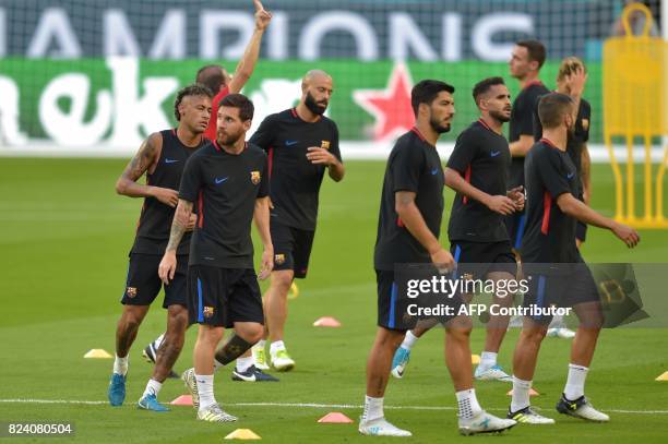 Barcelona players Lionel Messi and Neymar take part in a training session at Hard Rock Stadium in Miami, Florida, on July 28 one day before their...