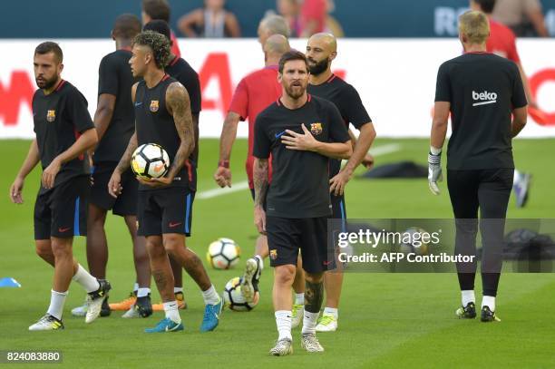 Barcelona players Lionel Messi and Neymar take part in a training session at Hard Rock Stadium in Miami, Florida, on July 28 one day before their...