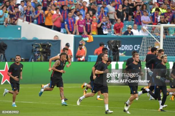 Barcelona player Neymar and teammates take part in a training session at Hard Rock Stadium in Miami, Florida, on July 28 one day before their...
