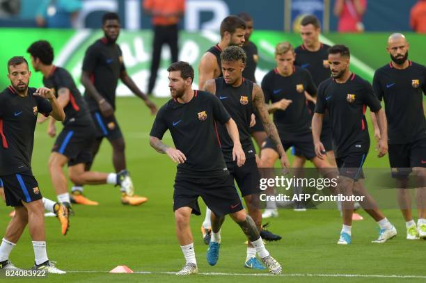 Barcelona players Lionel Messi and Neymar take part in a training session at Hard Rock Stadium in Miami, Florida, on July 28 one day before their...