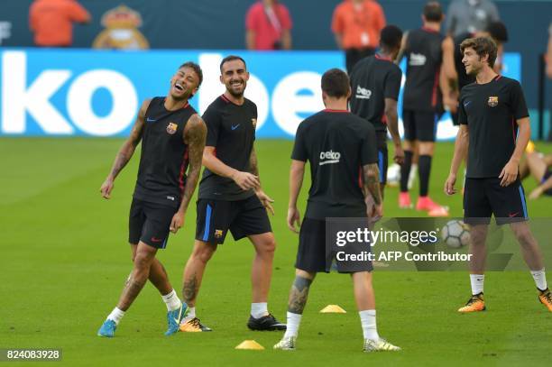 Barcelona players Neymar and teammates take part in a training session at Hard Rock Stadium in Miami, Florida, on July 28 one day before their...