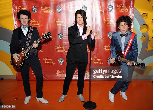 The Jonas Brothers wax figures the unveiling of wax figures at Madam Tussauds on August 18, 2008 in Washington, DC.