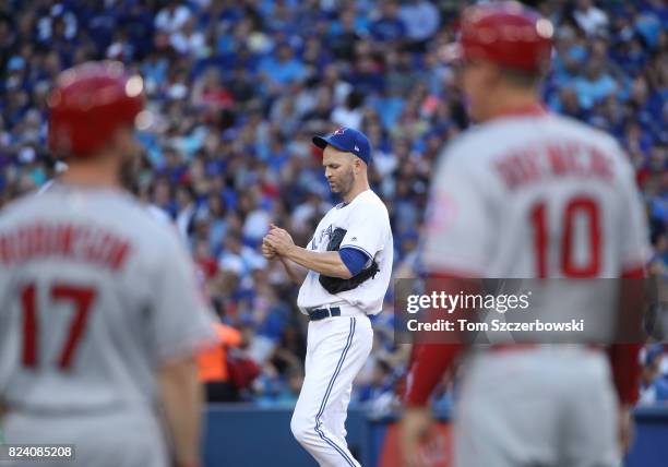 Happ of the Toronto Blue Jays reacts after failing to get a favorable call on a pitch in the second inning during MLB game action against the Los...