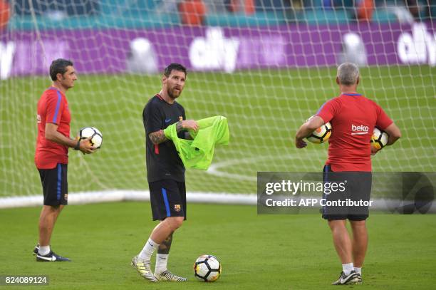 Barcelona player Lionel Messi takes part in a training session at Hard Rock Stadium in Miami, Florida, on July 28 one day before their International...