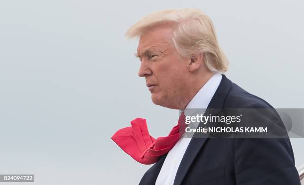 President Donald Trump arrives at Long Island MacArthur Airport in Ronkonkoma, New York July 28, 2017 to deliver remarks on law enforcement at...