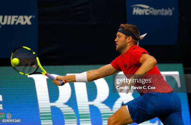 Jack Sock returns a forehand to Kyle Edmund of Great Britain during the BB&T Atlanta Open at Atlantic Station on July 28, 2017 in Atlanta, Georgia.