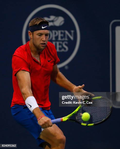 Jack Sock returns a backhand to Kyle Edmund of Great Britain during the BB&T Atlanta Open at Atlantic Station on July 28, 2017 in Atlanta, Georgia.