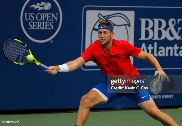 Jack Sock returns a forehand to Kyle Edmund of Great Britain during the BB&T Atlanta Open at Atlantic Station on July 28, 2017 in Atlanta, Georgia.