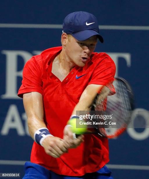 Kyle Edmund of Great Britain returns a backhand to Jack Sock during the BB&T Atlanta Open at Atlantic Station on July 28, 2017 in Atlanta, Georgia.