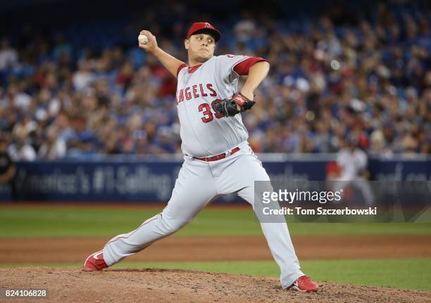 David Hernandez of the Los Angeles Angels of Anaheim delivers a pitch in the eighth inning during MLB game action against the Toronto Blue Jays at...
