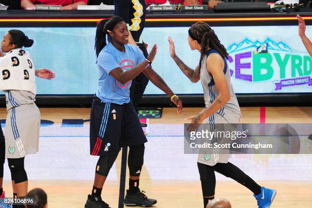 Matee Ajavon of the Atlanta Dream and Seimone Augustus of the Minnesota Lynx high five each other after the game during at WNBA game on July 28, 2017...