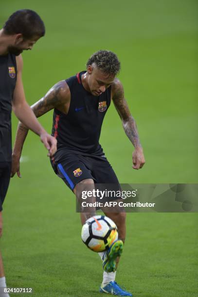 Barcelona's Brazilian forward Neymar takes part in a training session at Hard Rock Stadium in Miami, Florida, on July 28 one day before their...