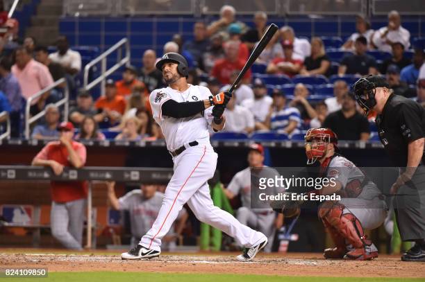Mike Aviles of the Miami Marlins hits a home run during the seventh inning against the Cincinnati Reds at Marlins Park on July 28, 2017 in Miami,...