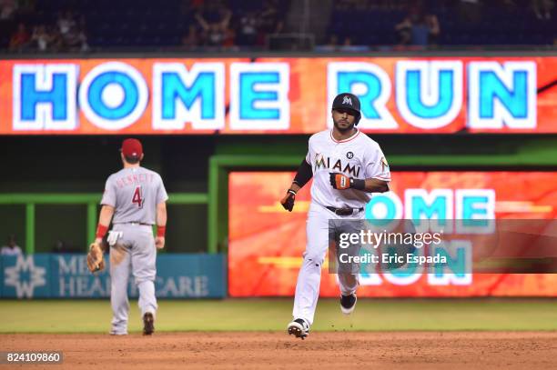 Mike Aviles of the Miami Marlins rounds second base after hitting a home run during the seventh inning against the Cincinnati Reds at Marlins Park on...
